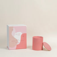 Flame festive citrus woody candle in pink ceramic jar