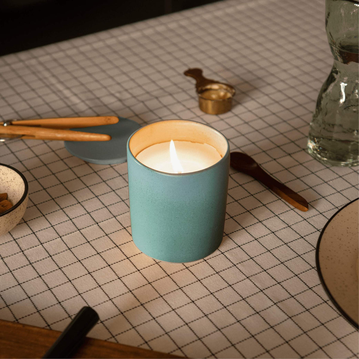 Lit Ljuv candle creating cozy serene ambiance