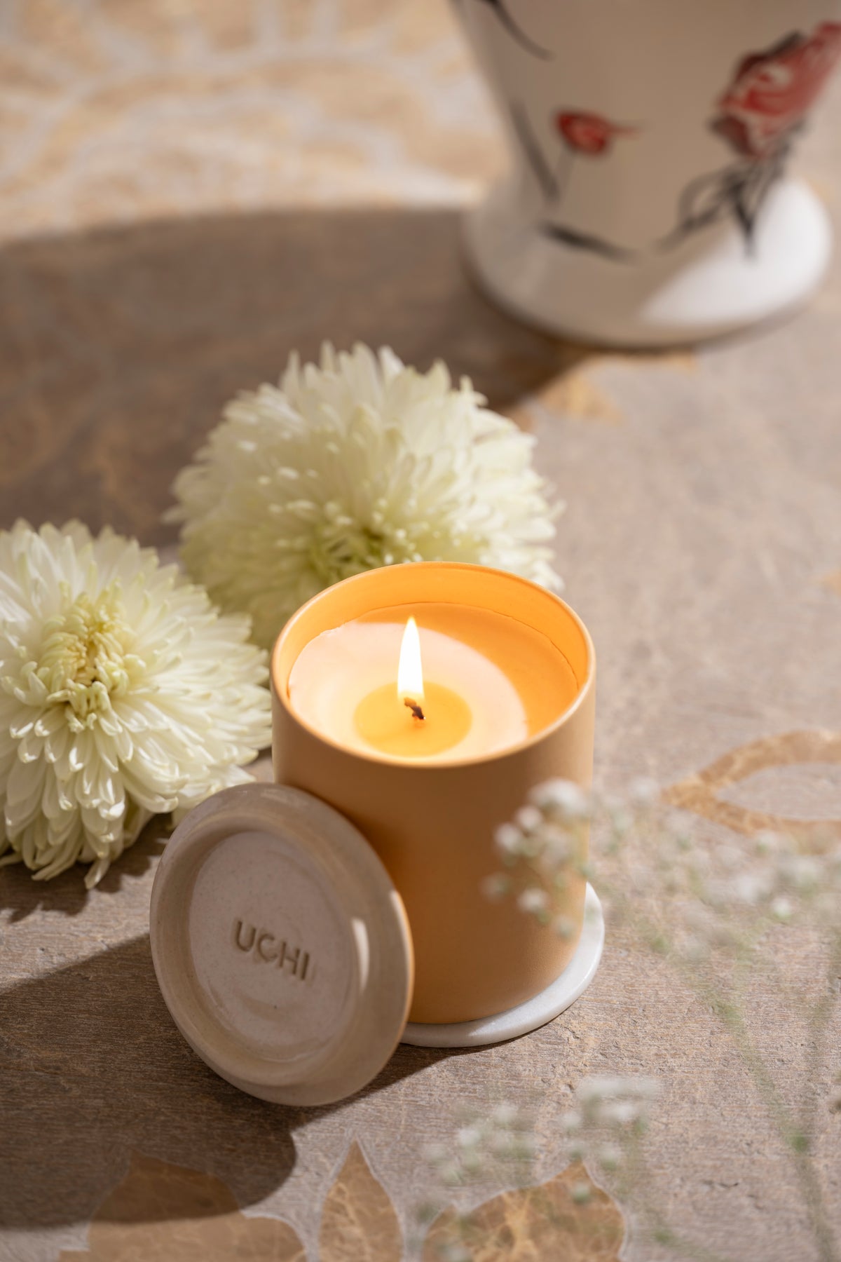 Lit Spring Garland candle creating serene ambiance