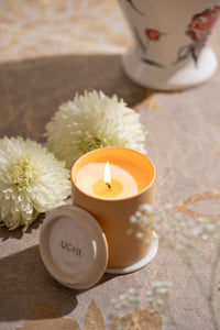 Lit Spring Garland candle creating serene ambiance
